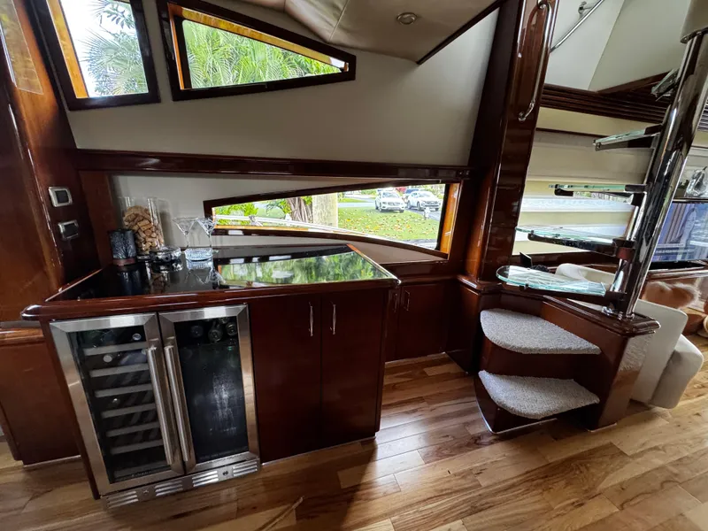 Slide: The Image of Luxurious interior of 2006 Marquis 65 yacht with sleek wood finishes and modern amenities. - 16