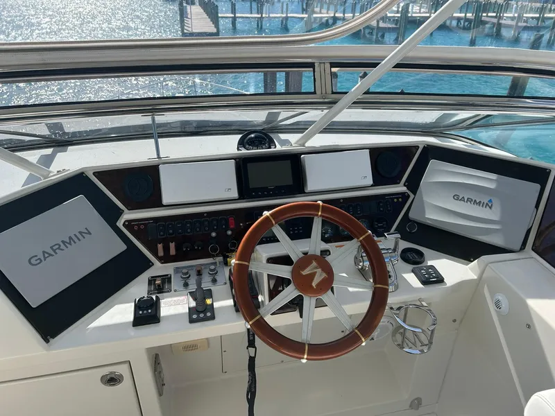 Slide: The Image of 2006 Marquis 65 yacht helm with Garmin navigation system and wooden steering wheel. - 4