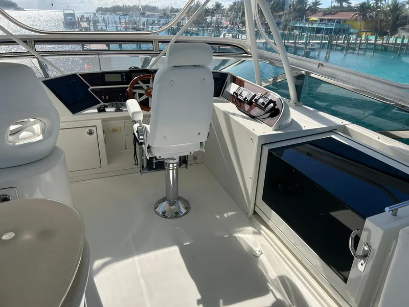 Slide: The Image of Luxurious 2006 Marquis 65 yacht cockpit with modern controls and ocean view. - 8