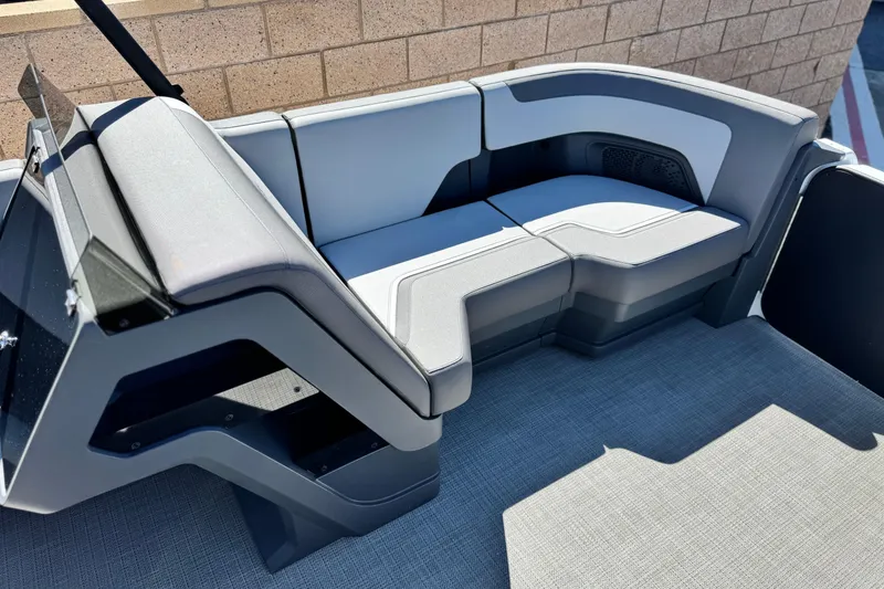 Slide: The Image of 2024 Manitou Cruise 22 boat interior with modern seating and sleek design. - 10