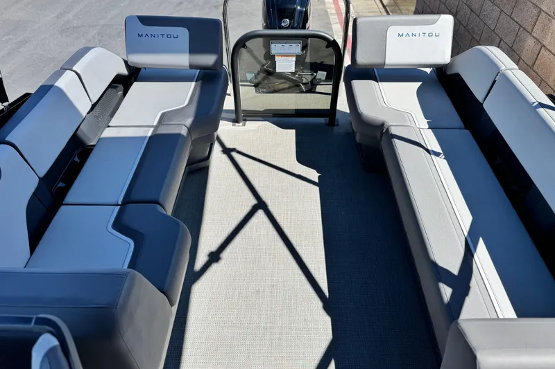 Slide: The Image of 2024 Manitou Cruise 22 pontoon boat interior with spacious seating and modern design. - 13