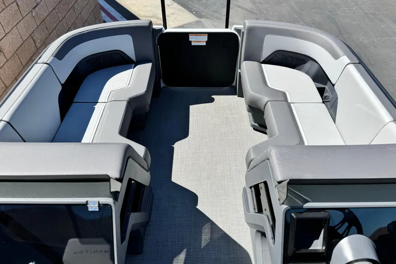 Slide: The Image of 2024 Manitou Cruise 22 pontoon boat interior with spacious seating and modern design. - 9