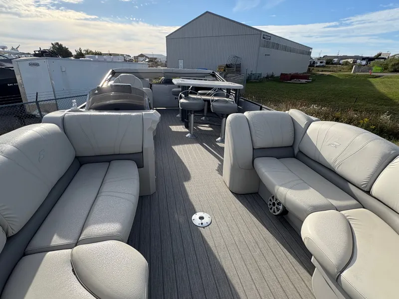 Slide: The Image of 2018 Starcraft CX 23 RE pontoon boat with spacious seating and modern design. - 4