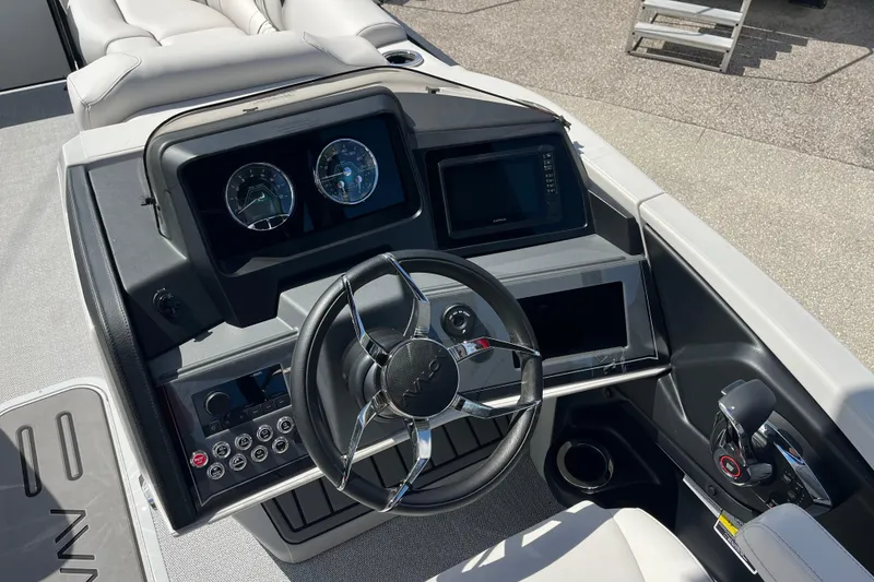 Slide: The Image of 2026 Avalon 2385 Catalina Quad Lounger interior with luxurious seating and modern dashboard. - 13