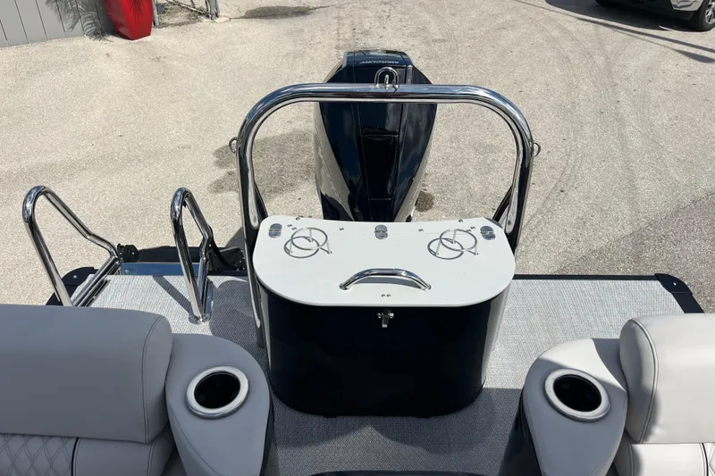 Slide: The Image of 2026 Avalon 2385 Catalina Quad Lounger boat interior with modern dashboard and plush seating. - 24