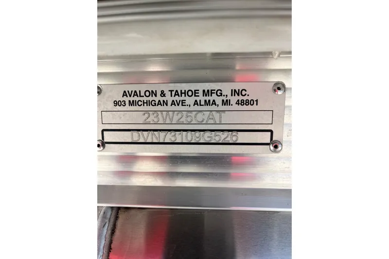 Slide: The Image of Steering console of 2026 Avalon 2385 Catalina Quad Lounger, featuring modern controls and gauges. - 25