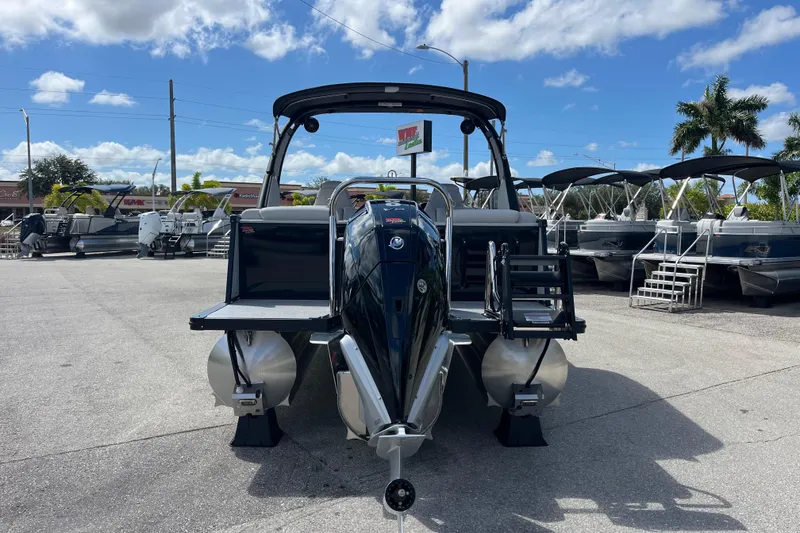 Slide: The Image of 2026 Avalon 2385 Catalina Quad Lounger Tri Toon, high-performance pontoon boat, docked outdoors. - 7