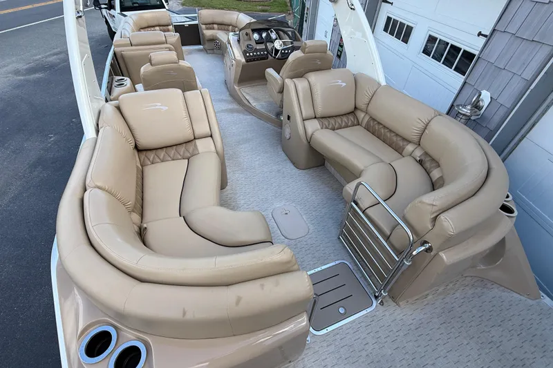 Slide: The Image of Luxurious interior of 2016 Bennington 2550 RSF Arch Tri Toon with plush seating. - 13