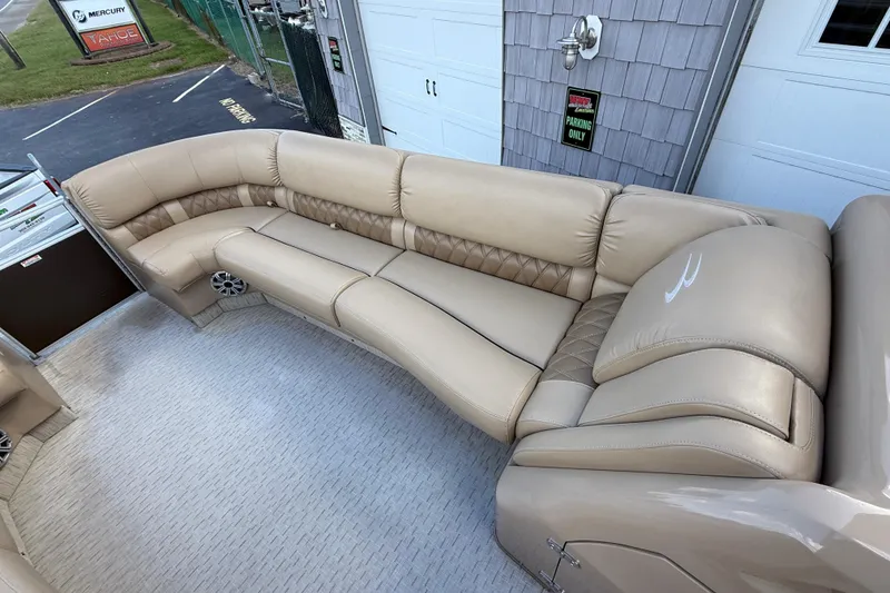 Slide: The Image of Luxurious seating on 2016 Bennington 2550 RSF Arch Tri Toon boat, featuring beige upholstery. - 20