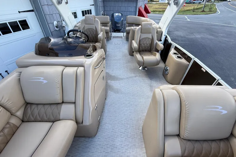 Slide: The Image of Luxurious interior of 2016 Bennington 2550 RSF Arch Tri Toon boat with plush seating. - 23