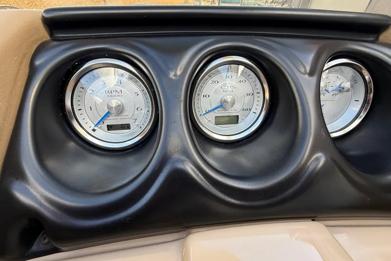 Slide: The Image of Dashboard gauges of a 2016 Bennington 2550 RSF Arch Tri Toon boat. - 29