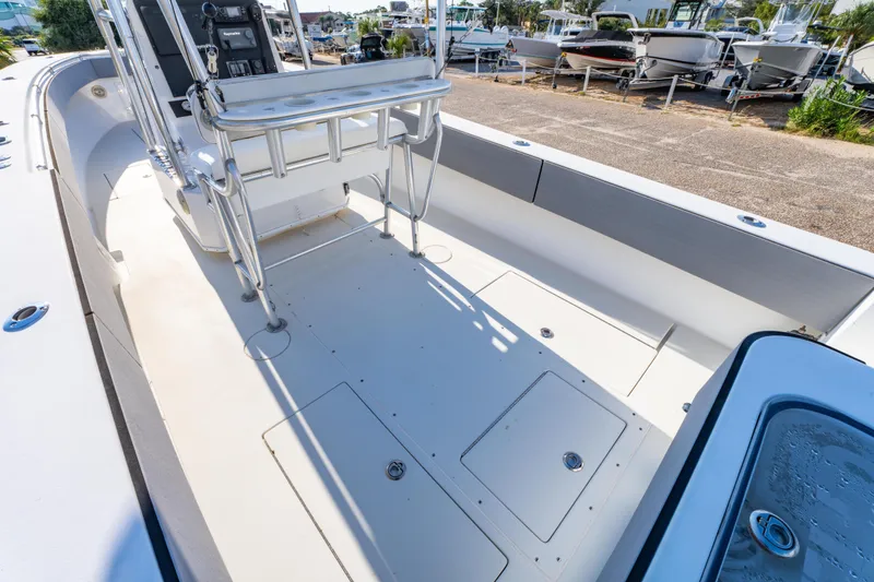 Slide: The Image of 1997 Contender 27 boat interior with seating and storage compartments. - 10