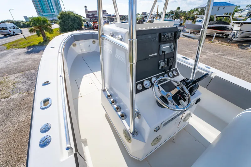 Slide: The Image of 1997 Contender 27 boat interior with steering console and navigation equipment. - 14