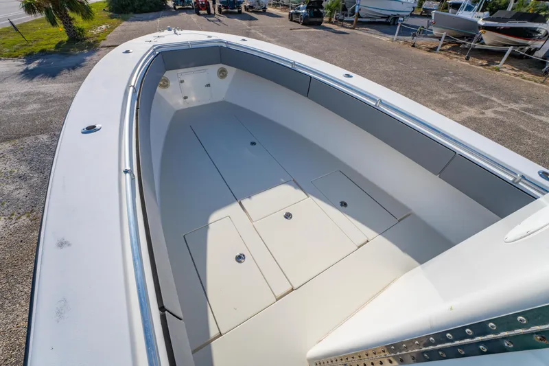 Slide: The Image of 1997 Contender 27 boat interior with spacious deck and storage compartments. - 20