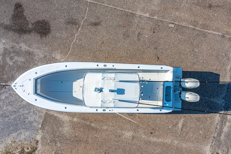Slide: The Image of Top view of a 1997 Contender 27 boat on a concrete surface. - 31