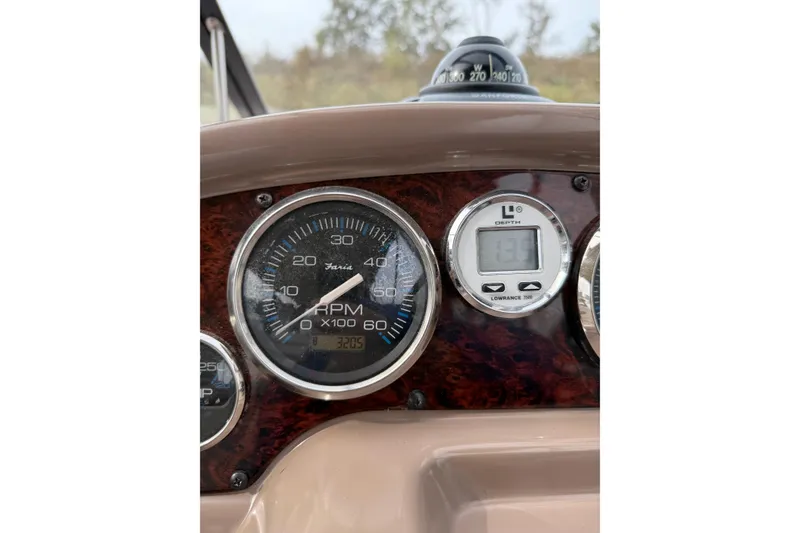 Slide: The Image of Dashboard of 2004 Regal Commodore 2765 showing RPM and depth gauges. - 7