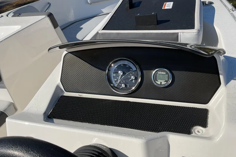 Slide: The Image of 2022 Bayliner Element M17 dashboard with gauges and controls. - 12