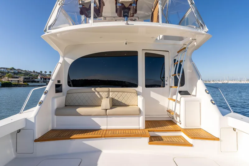 Slide: The Image of 2014 Viking 46 Convertible yacht with elegant seating and ocean view. - 10