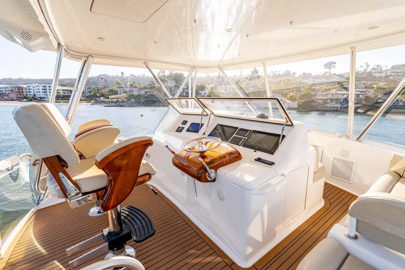 Slide: The Image of Luxurious interior of 2014 Viking 46 Convertible yacht with elegant helm and seating. - 13