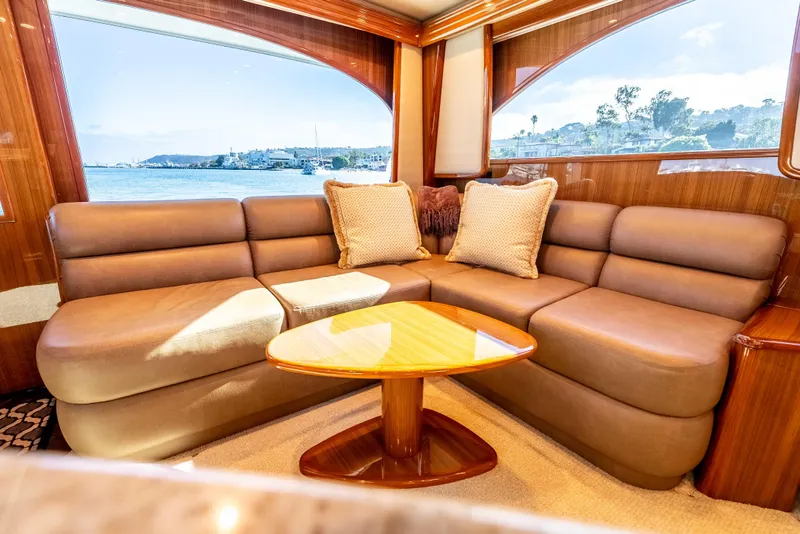 Slide: The Image of Luxurious interior of 2014 Viking 46 Convertible yacht with plush seating and scenic window view. - 21