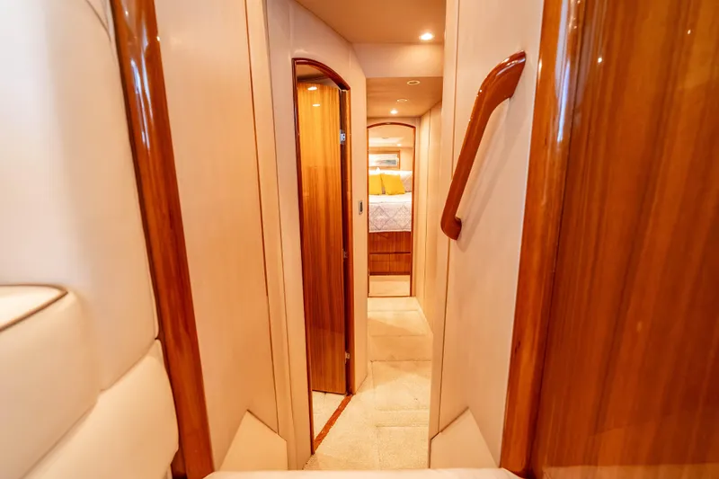 Slide: The Image of Luxurious interior hallway of 2014 Viking 46 Convertible yacht with wood accents. - 26