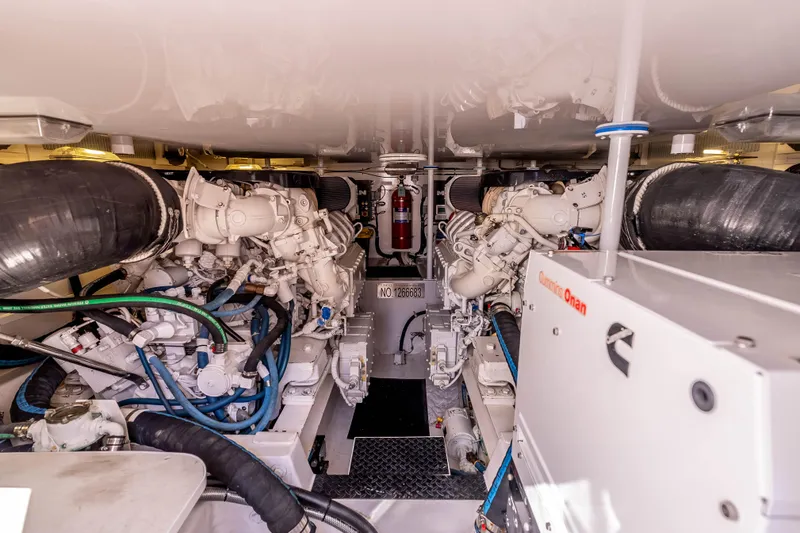 Slide: The Image of Engine room of 2014 Viking 46 Convertible yacht with Cummins Onan generator. - 36