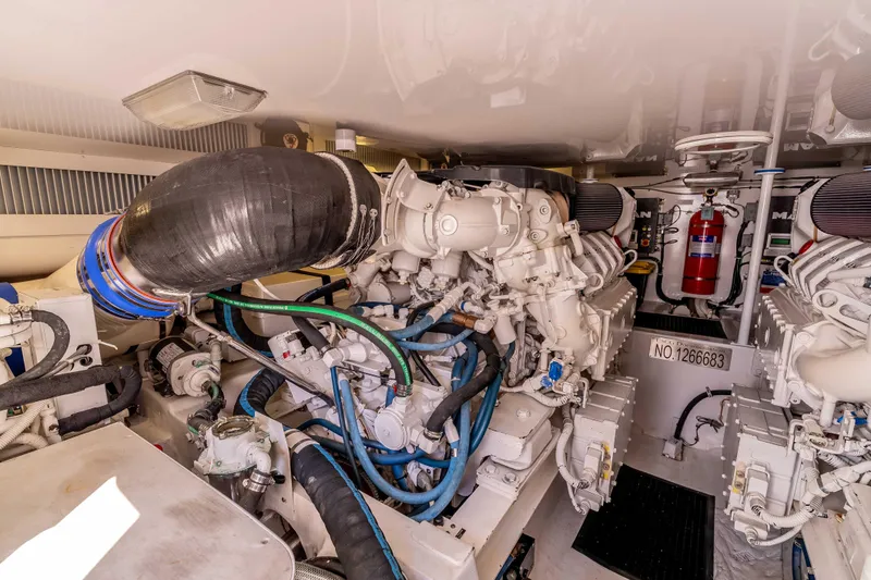 Slide: The Image of Engine room of 2014 Viking 46 Convertible yacht, featuring advanced machinery and equipment. - 37