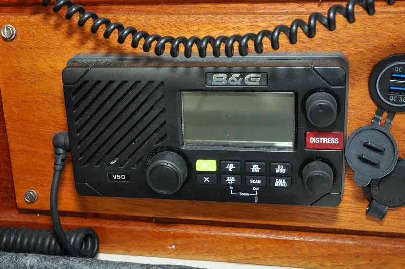 Slide: The Image of B&G V50 marine radio on 1986 Sabre 36 sailboat, featuring distress button. - 59