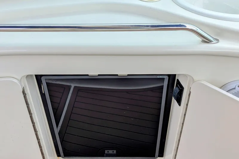 Slide: The Image of 2001 Sea Ray 340 Sundancer boat interior with Norcold refrigerator and sleek design. - 17