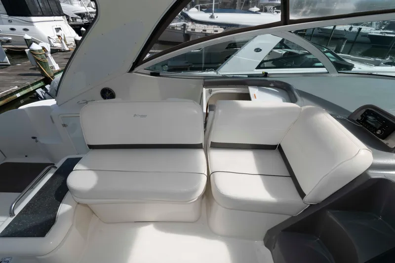 Slide: The Image of 2007 Cruisers Yachts 420 Express interior with white seating and sleek design. - 8