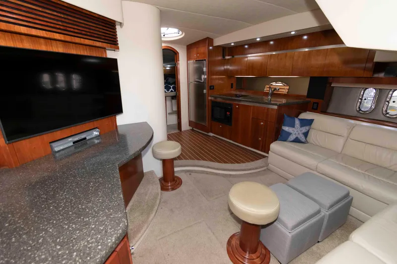 Slide: The Image of Luxurious 2007 Cruisers Yachts 420 Express interior with modern kitchen and cozy seating area. - 9