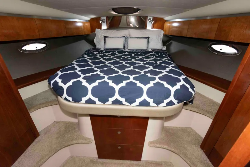 Slide: The Image of Luxurious cabin interior of 2007 Cruisers Yachts 420 Express with elegant bedding. - 15