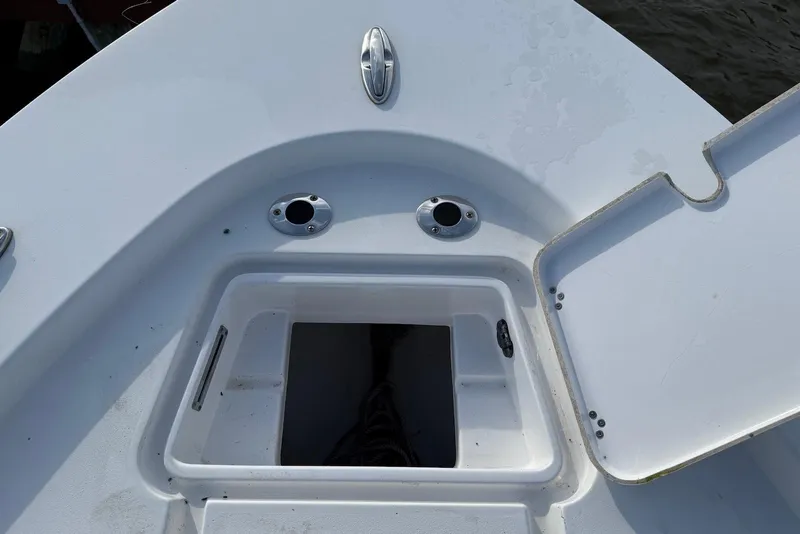 Slide: The Image of 2015 Sportsman Masters 247 Bay Boat deck with open storage compartment. - 12