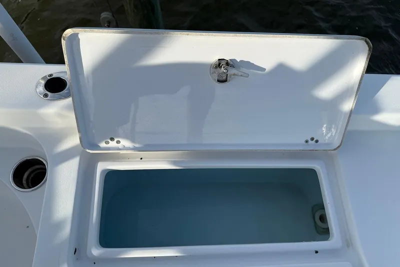 Slide: The Image of Open storage compartment on 2015 Sportsman Masters 247 Bay Boat. - 17