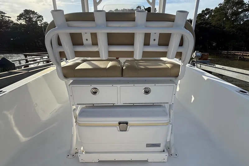 Slide: The Image of 2015 Sportsman Masters 247 Bay Boat with cushioned seating and storage compartments. - 19