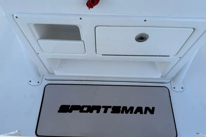Slide: The Image of 2015 Sportsman Masters 247 Bay Boat storage compartment and logo detail. - 23