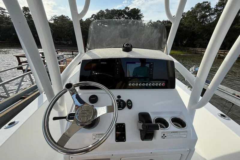 Slide: The Image of 2015 Sportsman Masters 247 Bay Boat console with steering wheel and navigation system. - 5