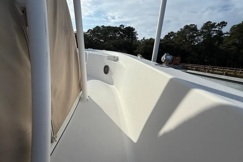 Slide: The Image of 2015 Sportsman Masters 247 Bay Boat deck view with clear skies and trees in background. - 8