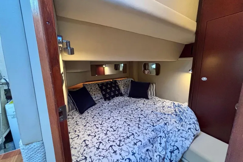 Slide: The Image of Luxurious interior of 2005 Sea Ray 420 Sedan Bridge yacht with leather seating and elegant decor. - 14