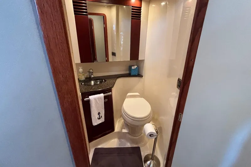 Slide: The Image of Luxurious interior of 2005 Sea Ray 420 Sedan Bridge yacht with elegant seating and modern amenities. - 15