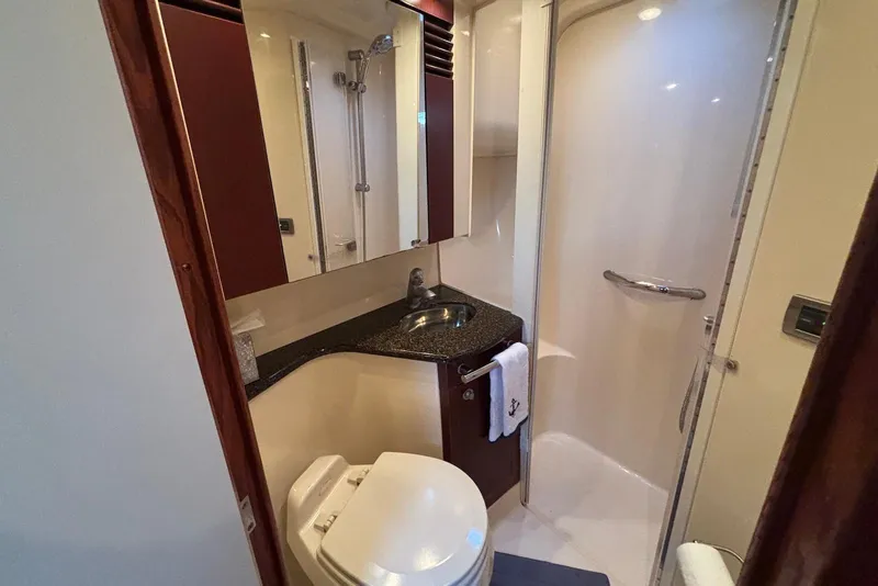 Slide: The Image of Luxurious interior of 2005 Sea Ray 420 Sedan Bridge yacht with leather seating and panoramic windows. - 17