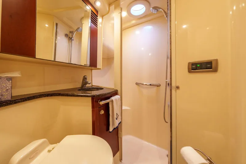 Slide: The Image of Luxurious bathroom in 2005 Sea Ray 420 Sedan Bridge yacht with shower and vanity. - 23