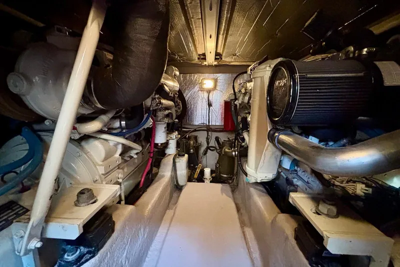 Slide: The Image of Engine room of 2005 Sea Ray 420 Sedan Bridge, showcasing mechanical components and systems. - 27