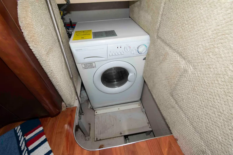 Slide: The Image of Washing machine in 2005 Sea Ray 420 Sedan Bridge yacht interior. - 32