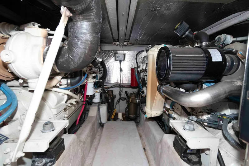 Slide: The Image of Engine room of 2005 Sea Ray 420 Sedan Bridge, showcasing mechanical components and systems. - 34