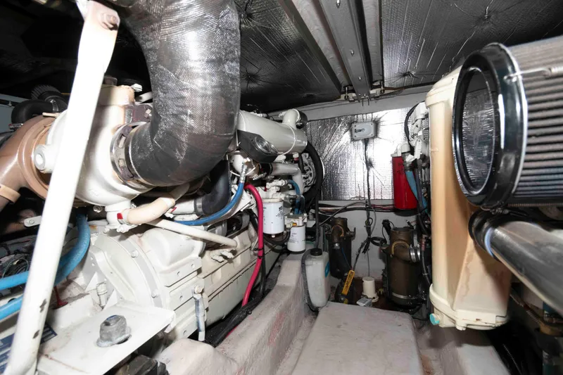 Slide: The Image of Engine room of a 2005 Sea Ray 420 Sedan Bridge yacht, showcasing mechanical components. - 35