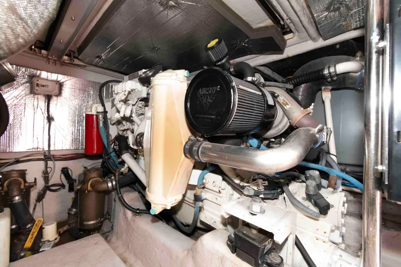 Slide: The Image of Engine room of a 2005 Sea Ray 420 Sedan Bridge yacht, showcasing mechanical components. - 36