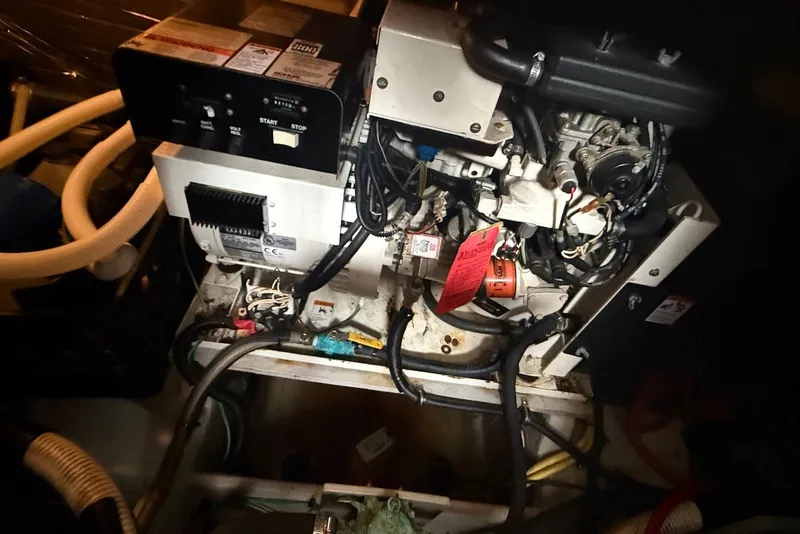 Slide: The Image of Luxurious interior of 2004 Meridian 408 Motoryacht with beige sofa and modern kitchen amenities. - 15