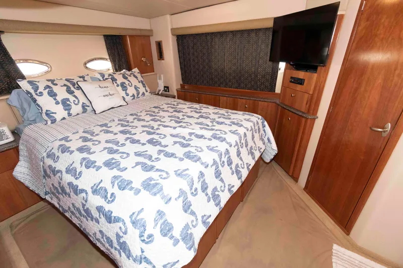 Slide: The Image of Luxurious bedroom in 2004 Meridian 408 Motoryacht with seahorse-themed bedding and TV. - 17