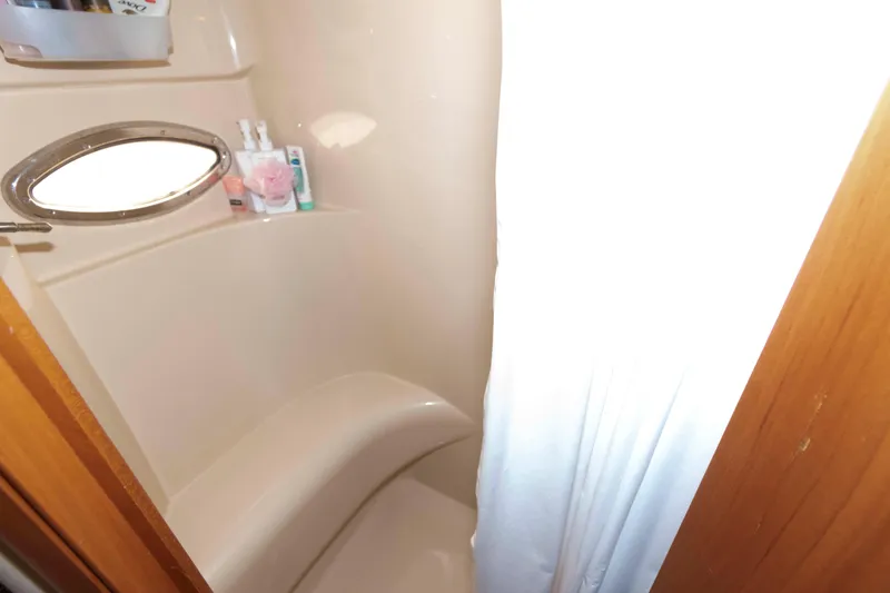 Slide: The Image of Bathroom interior of 2004 Meridian 408 Motoryacht with porthole and toiletries. - 20